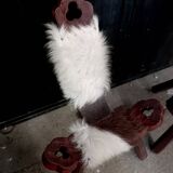 Pair of brutalist tripod chairs in wood and cowhide