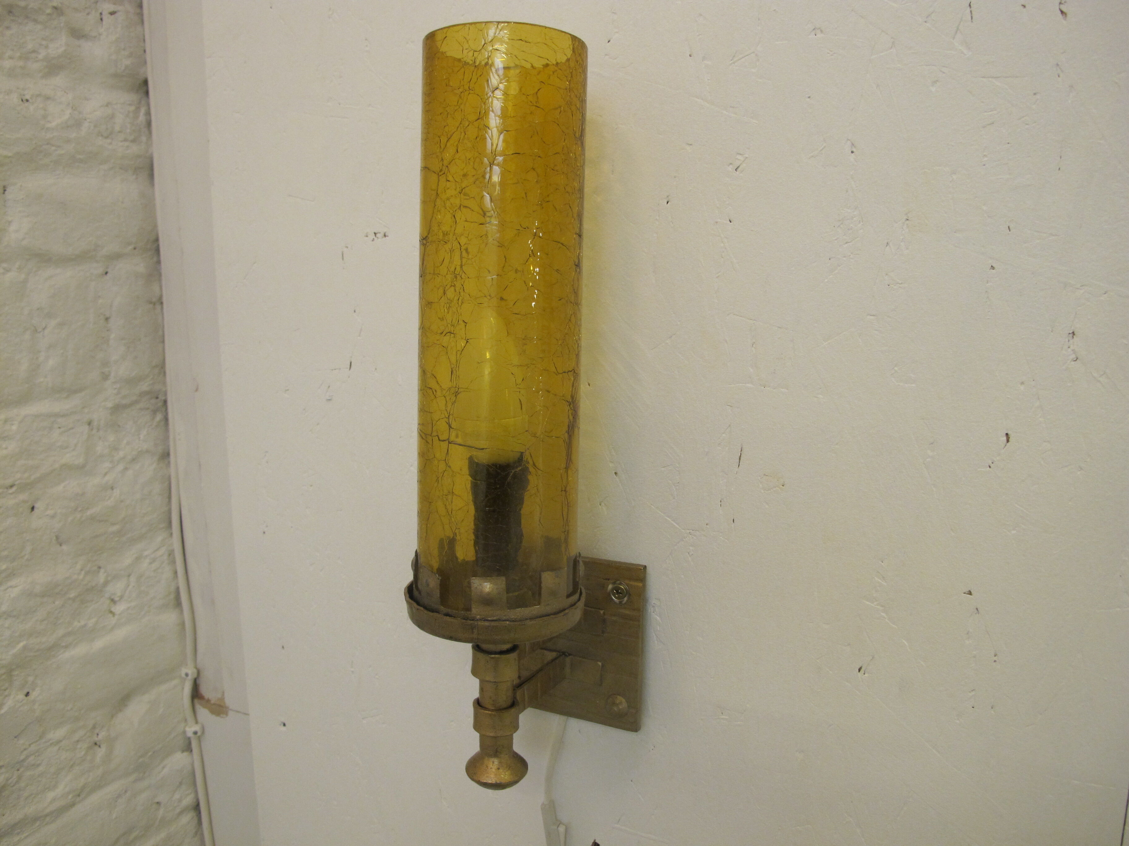 Pair of wall sconces, folded metal and yellow "shattered" glass