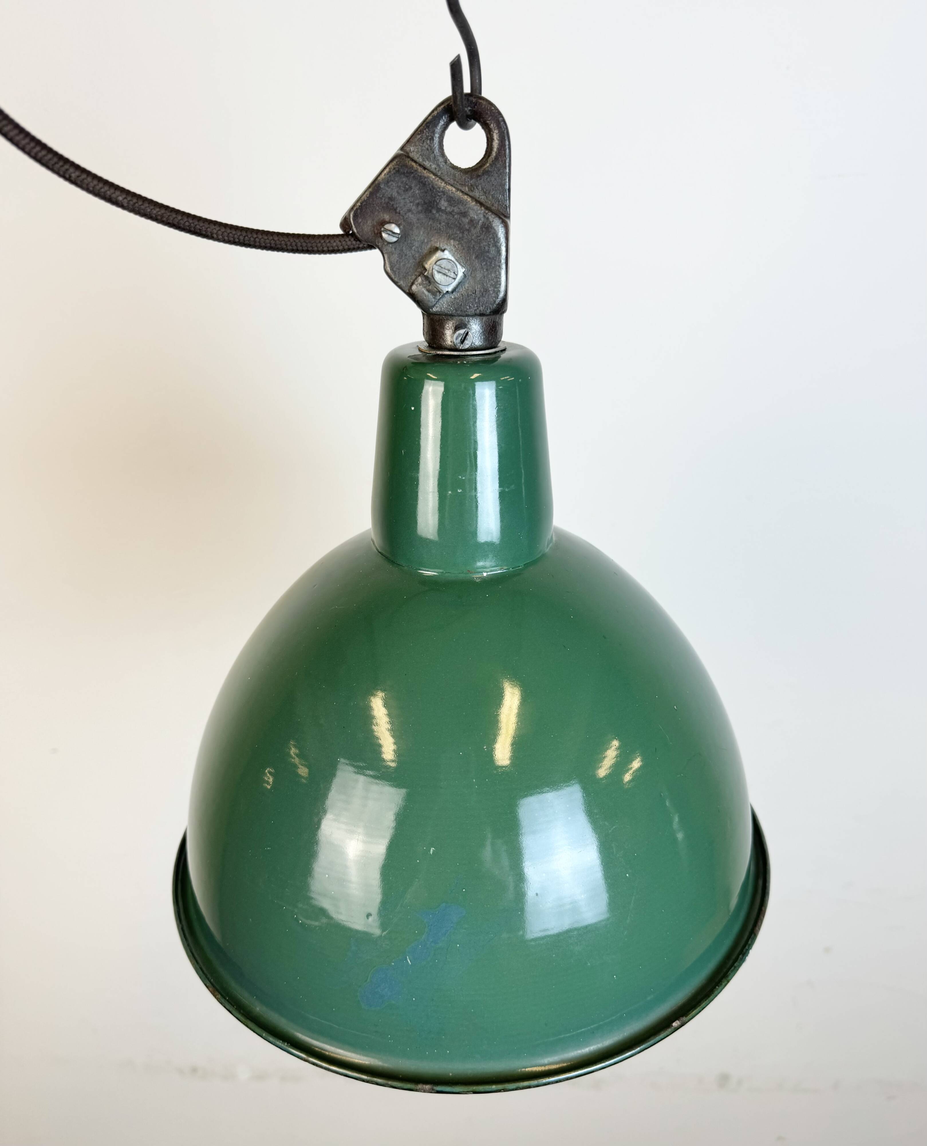 Industrial green enamel factory lamp with cast iron top, 1960s