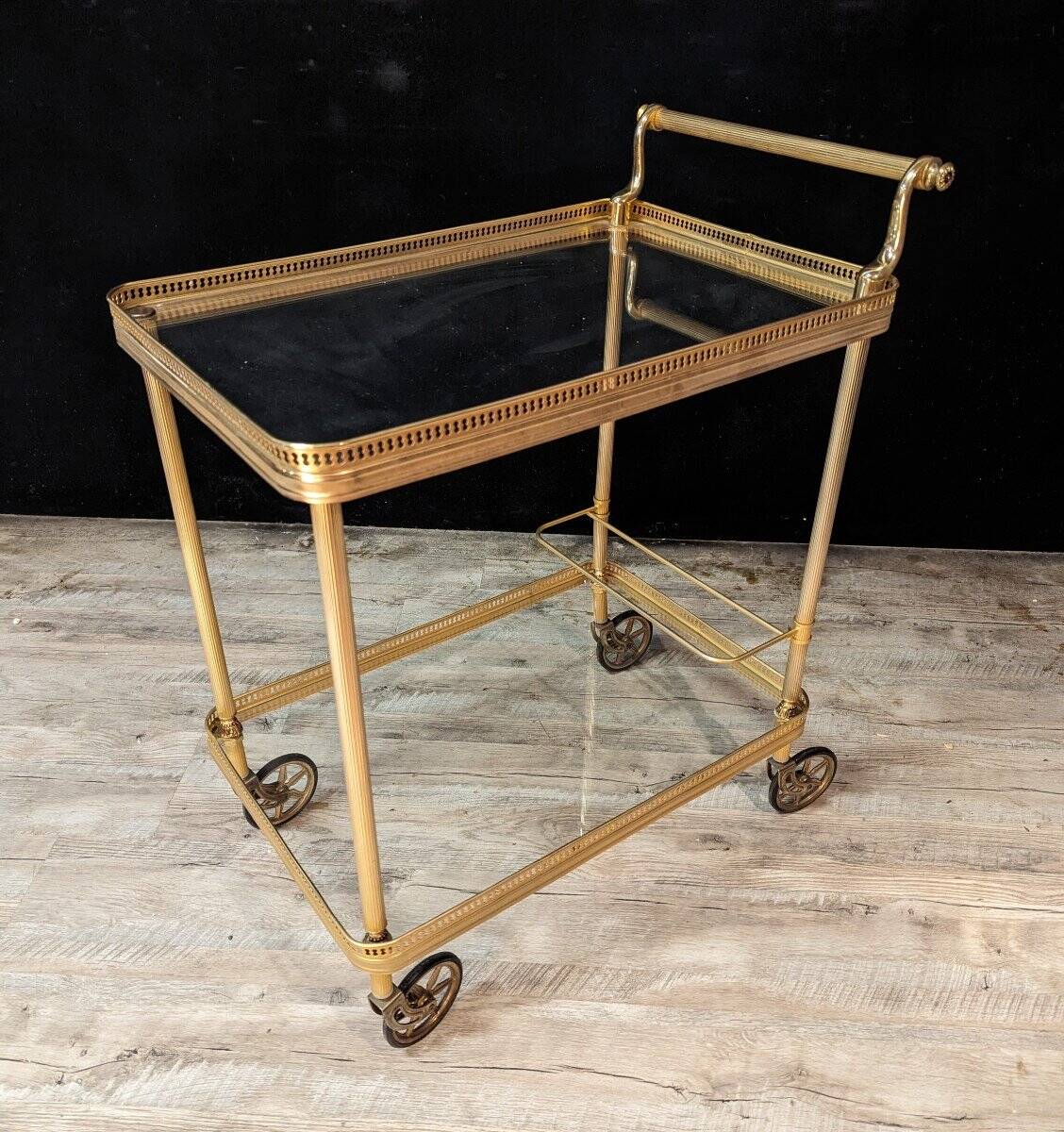 1970s serving trolley in brass and gilded bronze.