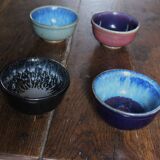 A set of 4 pottery bowls in coloured glaze.