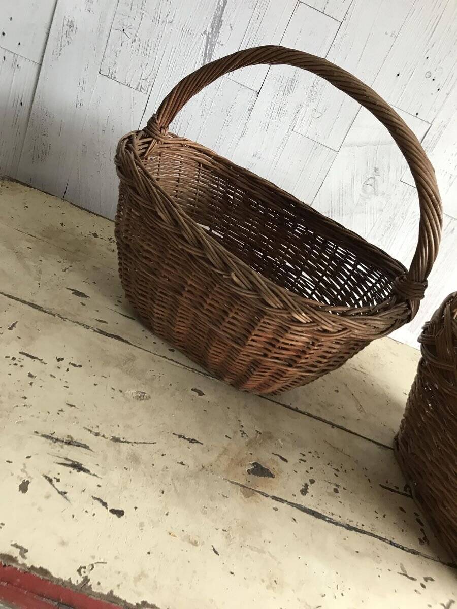 Set of 2 brown wicker baskets from the 1960s — decorative weaving and double handles.