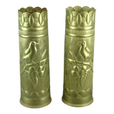 Pair of shell casings forming repulsed copper vases