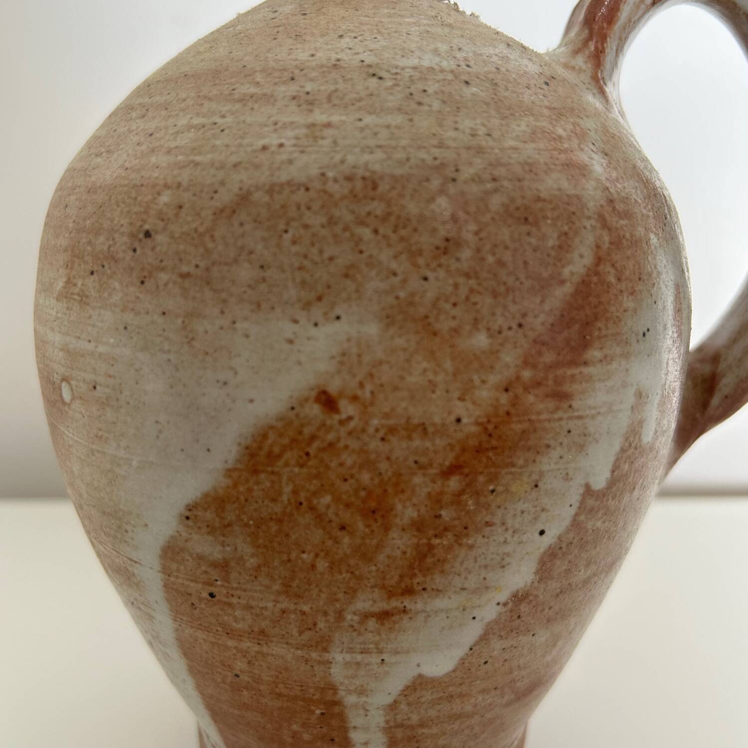 Patinated stoneware jug