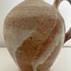 Patinated stoneware jug