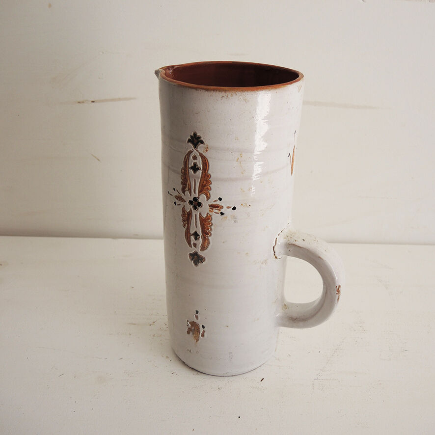Old glazed terracotta carafe with signature