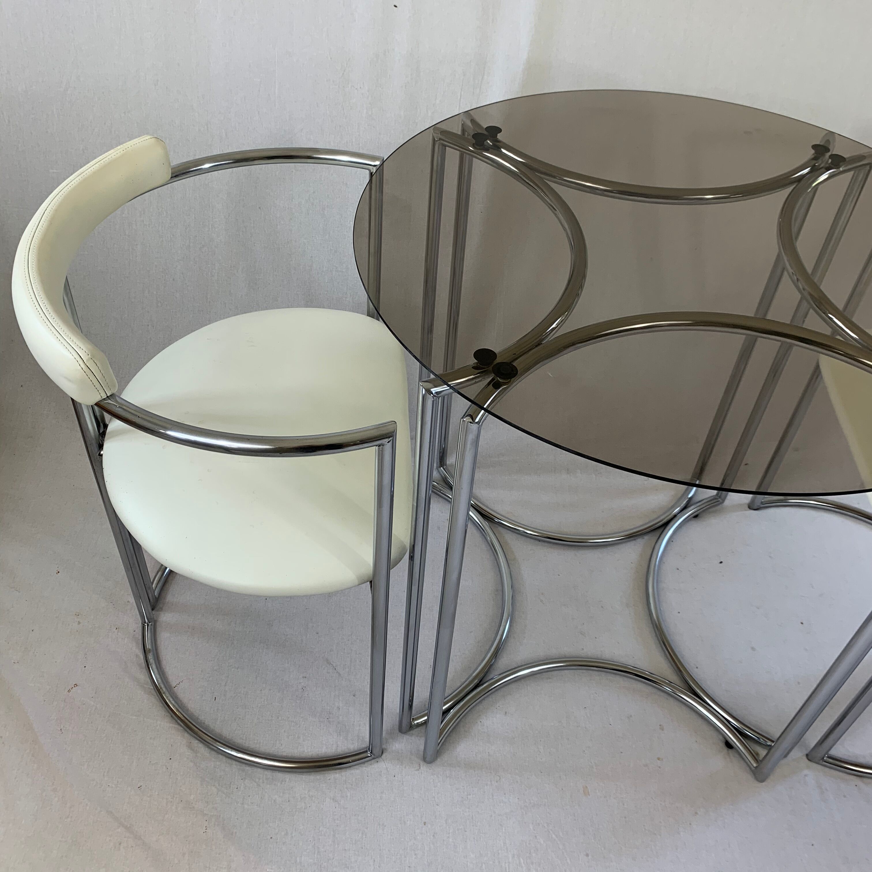Chrome table and two modernist chairs