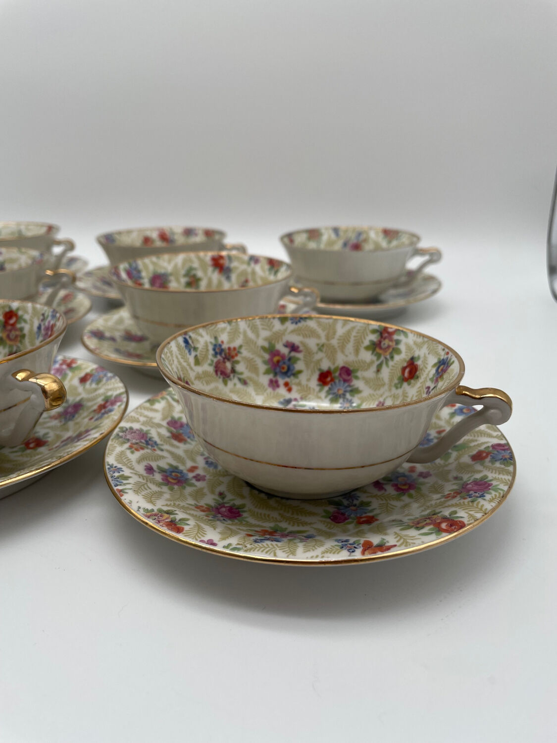 Set of 8 Limoges porcelain coffee cups from France with floral and gold pattern