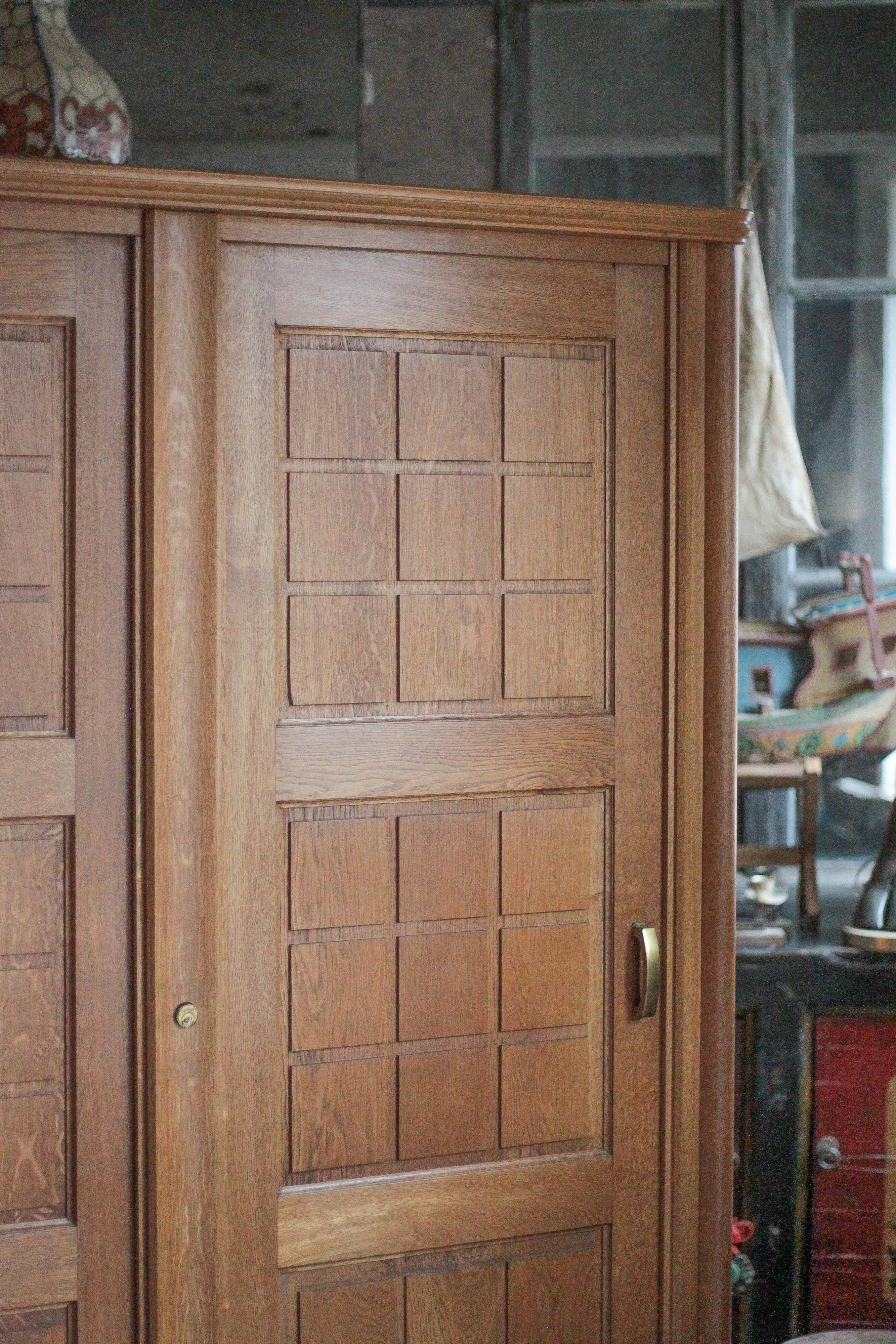 Vintage wooden wardrobe with sliding doors.