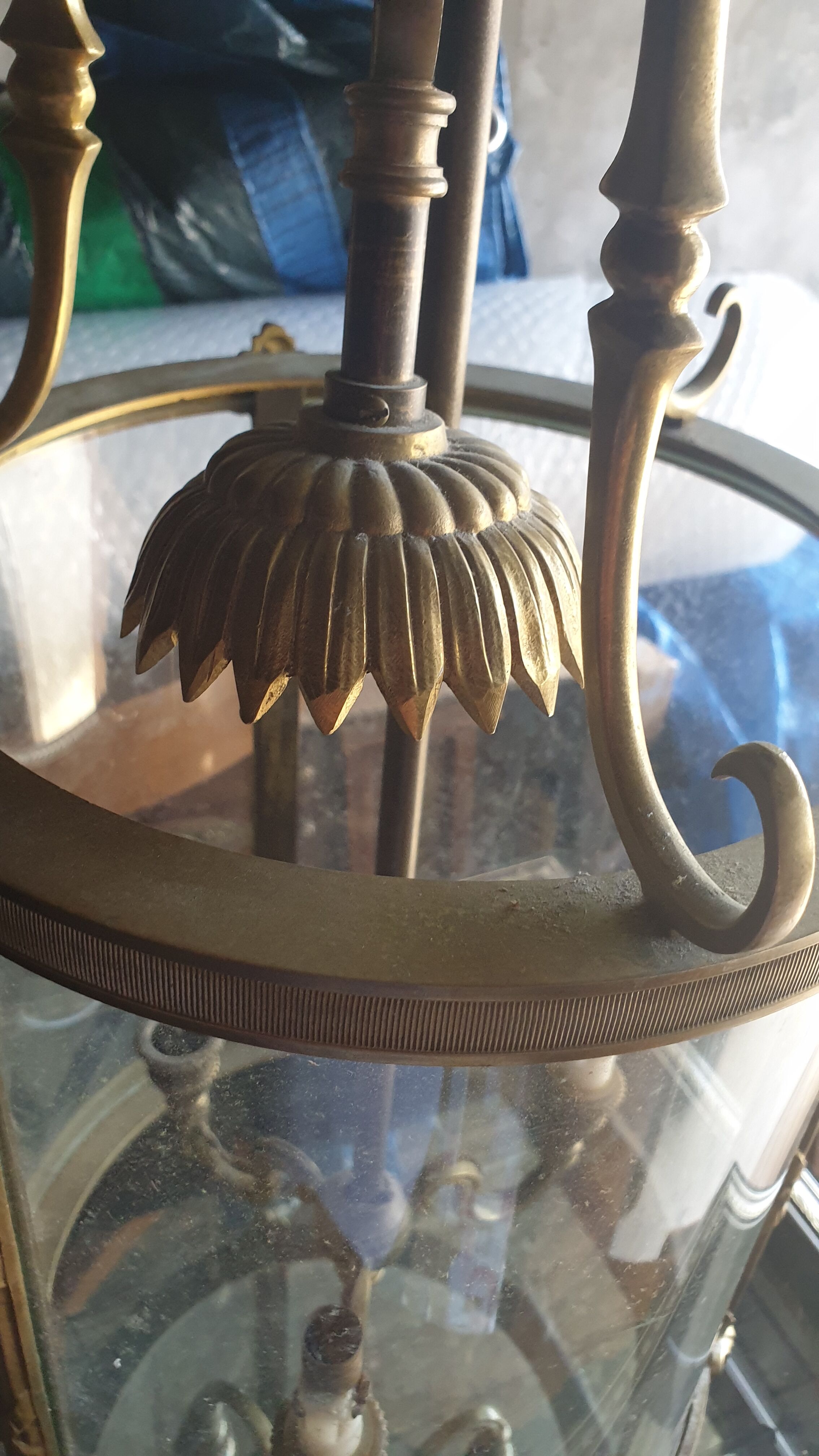 Suspension in glass and brass