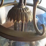 Suspension in glass and brass