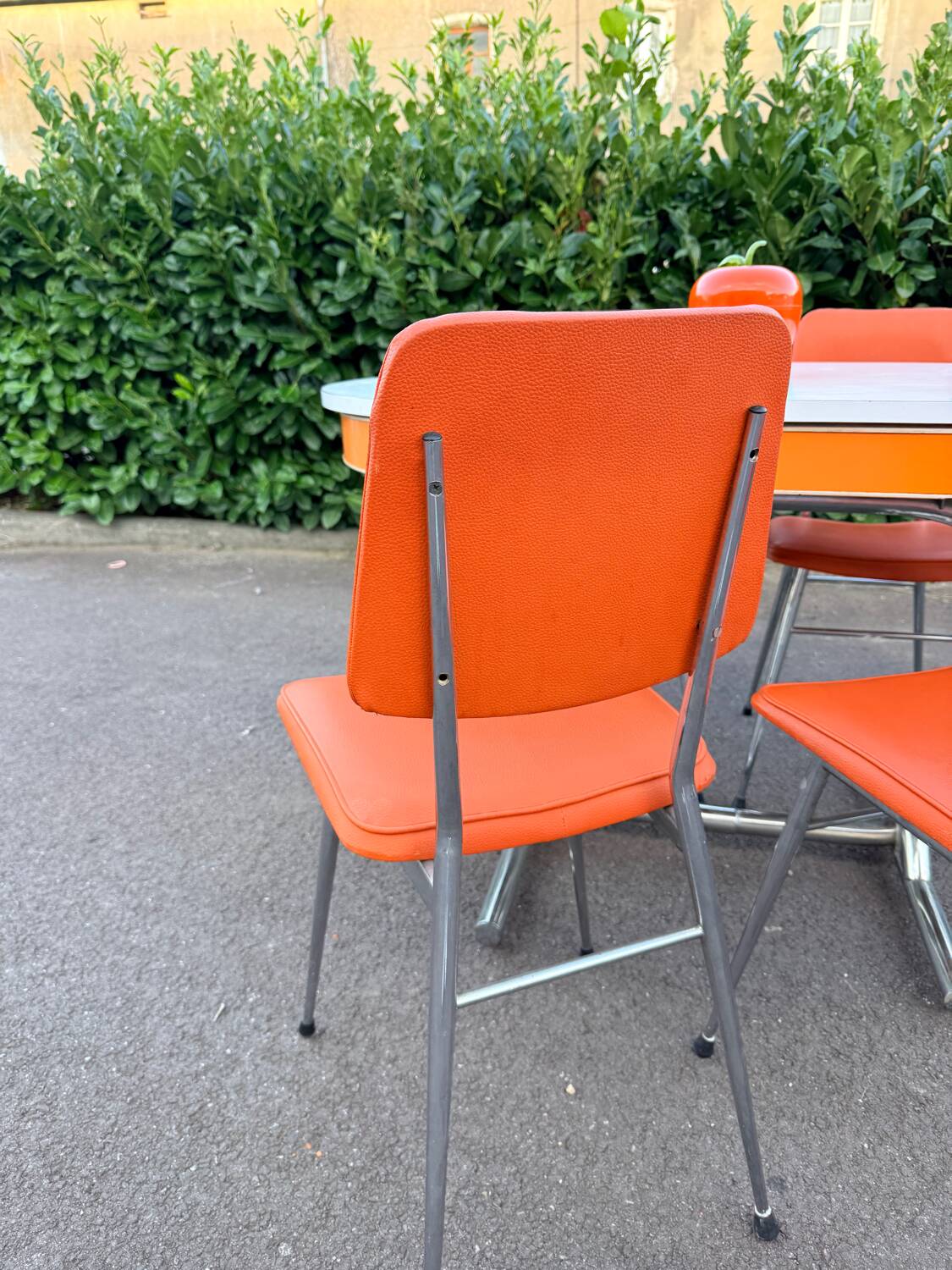 Formica leatherette chair with orange table, vintage 70s Space Age