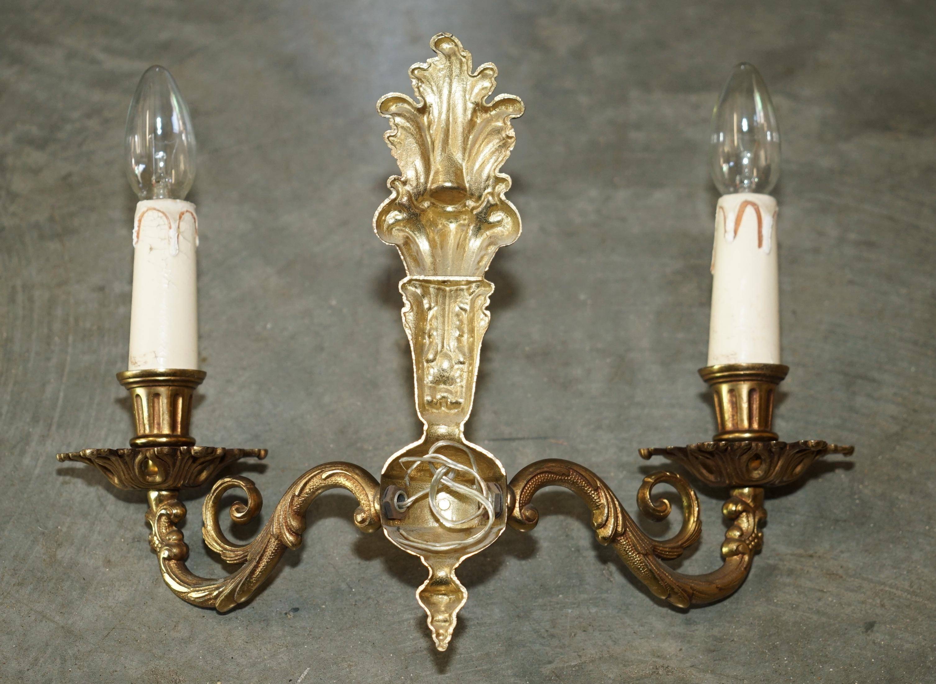 Pair of antique wall sconces in gilded bronze from the 1920s.