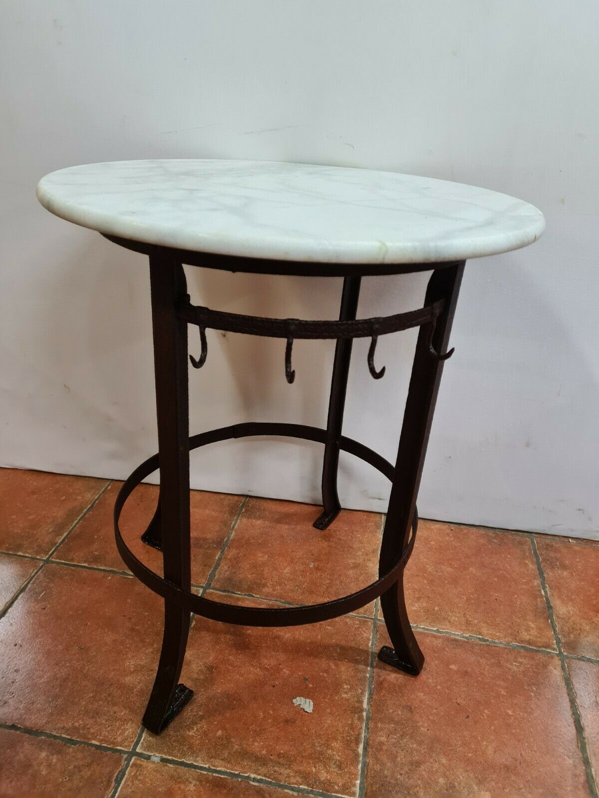 Iron pedestal table and marble top
