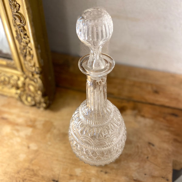 Large blown glass decanter and relief decoration