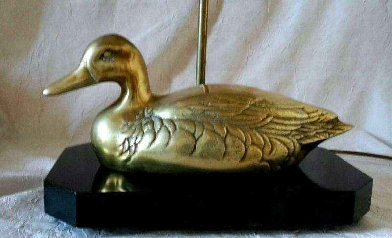 Lamp with brass duck on lacquered wood base