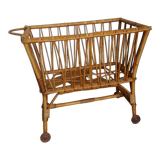 Rattan wicker cradle on wooden wheels