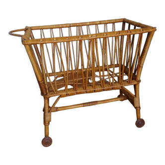 Rattan wicker cradle on wooden wheels