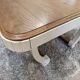Restored oak table in natural wood and linen.