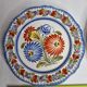Pair of Henriot Quimper plates decorated with flower, 24 cm