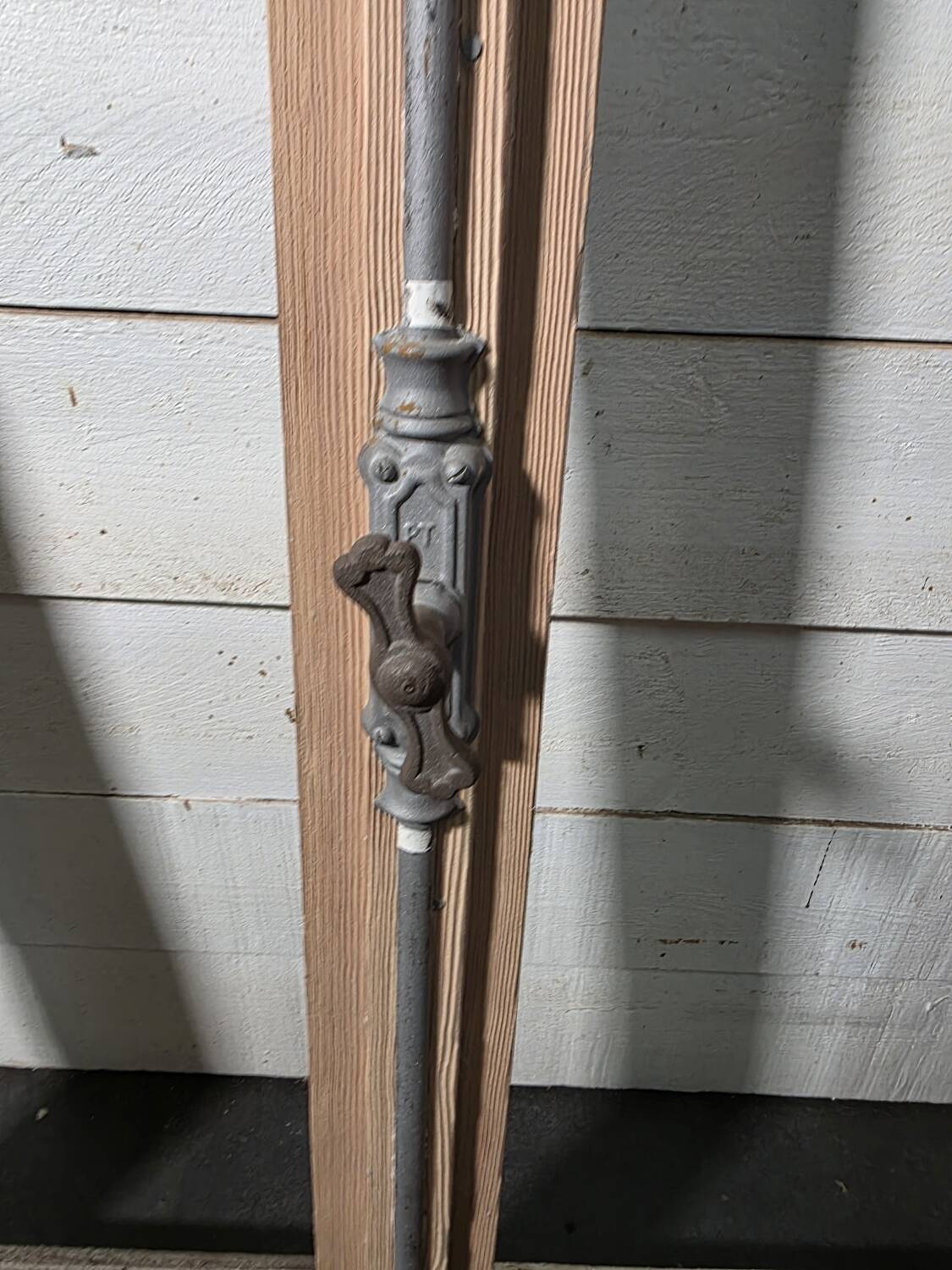 Old arched window made of fir wood