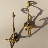 Pair of gilded bronze hooks Louis XVI style, nineteenth century.