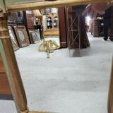 Empire style mirror in wood and gilding