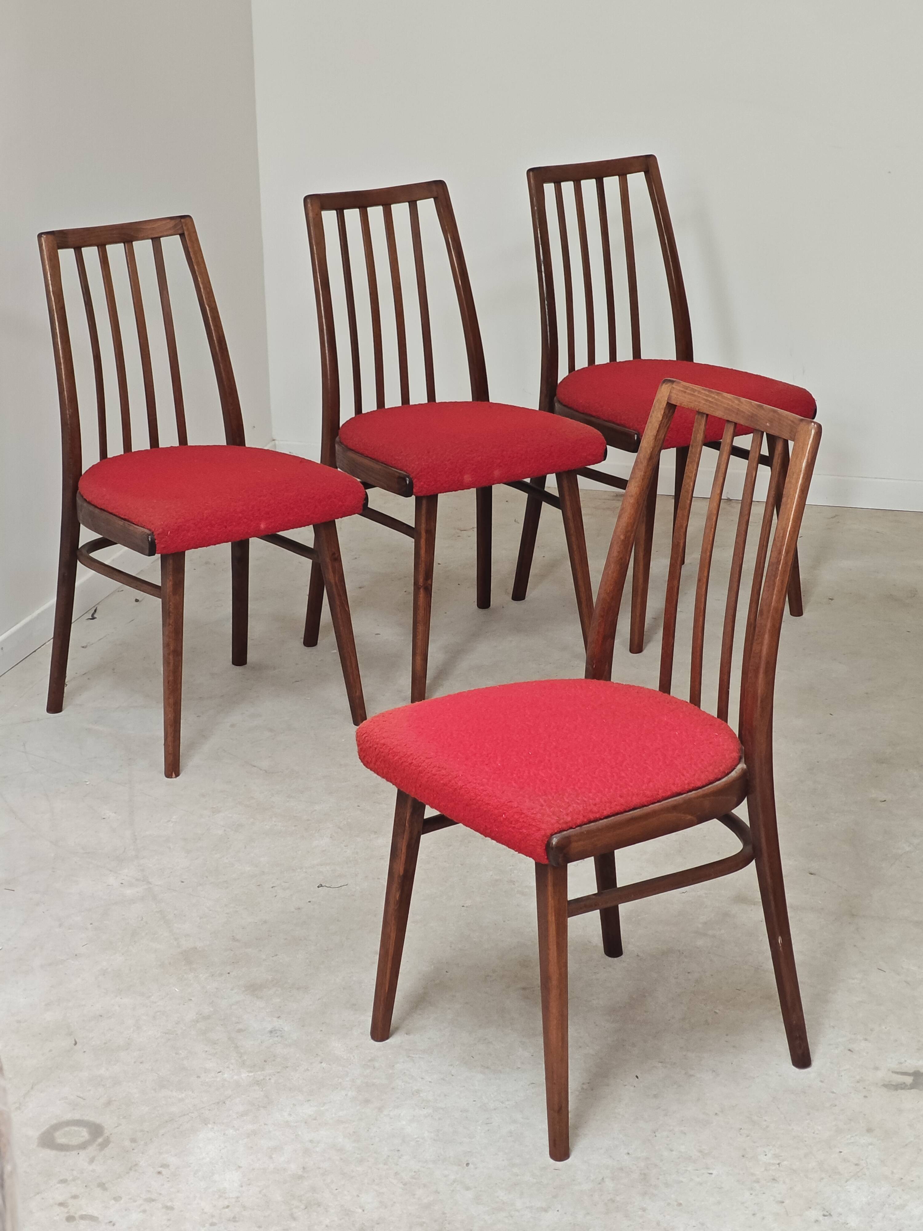 Set of 4 red dining chairs by Antonin Suman for Interier Praha.
