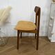 Scandinavian chair with mustard yellow fabric