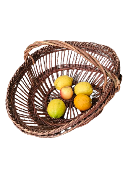 Vintage wicker basket with openwork, sun weaving and large handle.