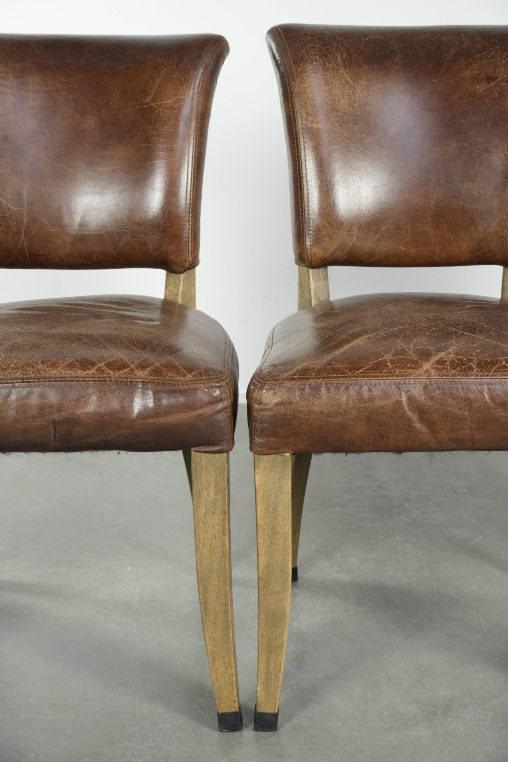 Set of 4 vintage cowhide and wooden dining chairs