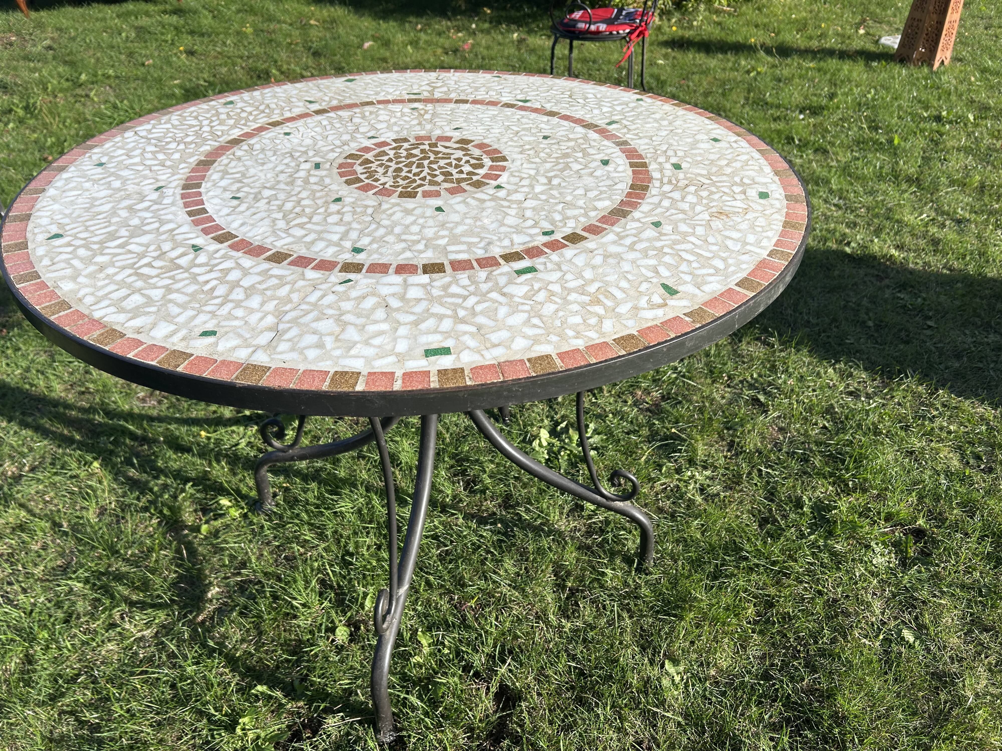 Iron table with ceramic top
