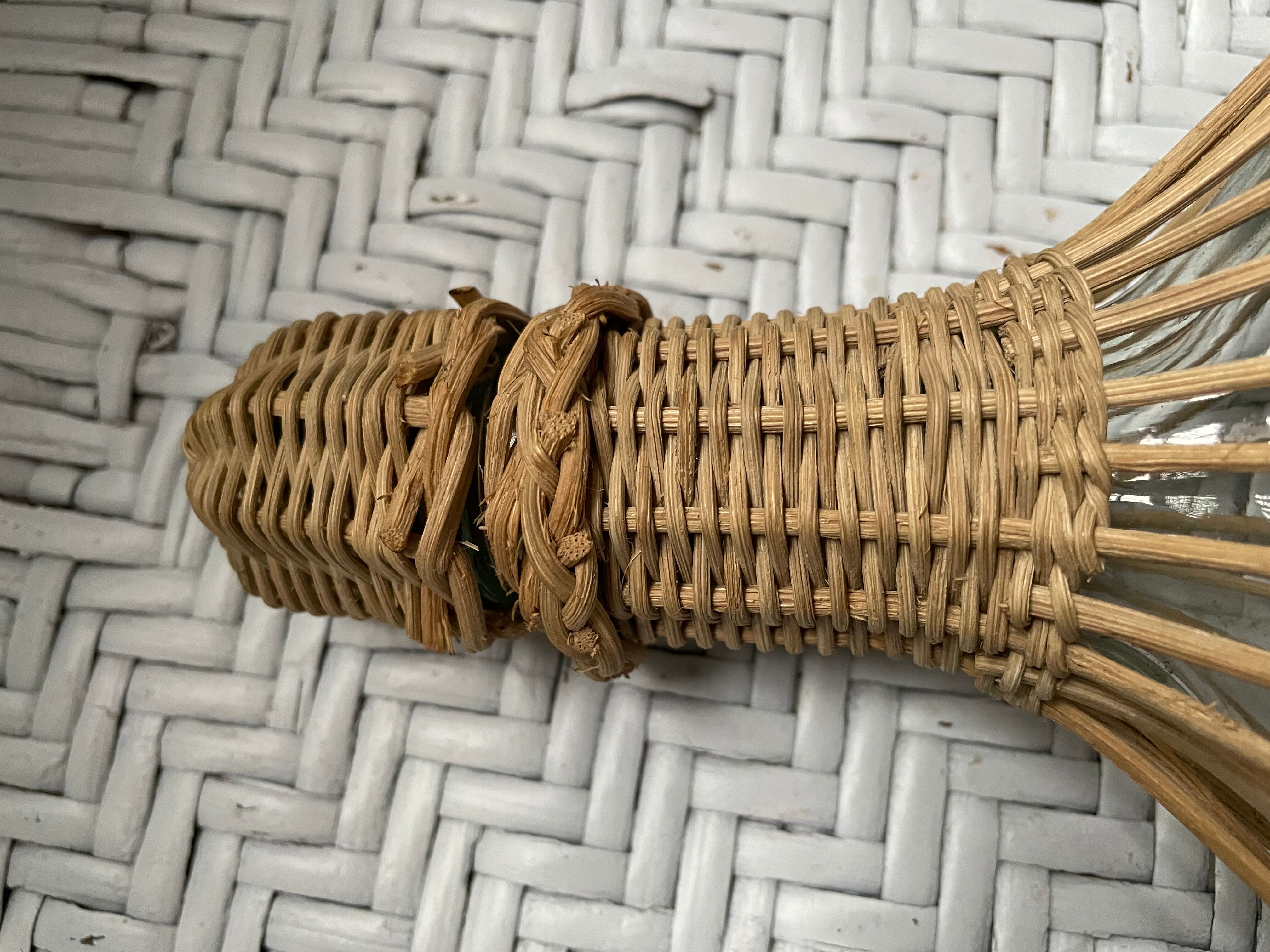 Wicker-sheathed glass bottle
