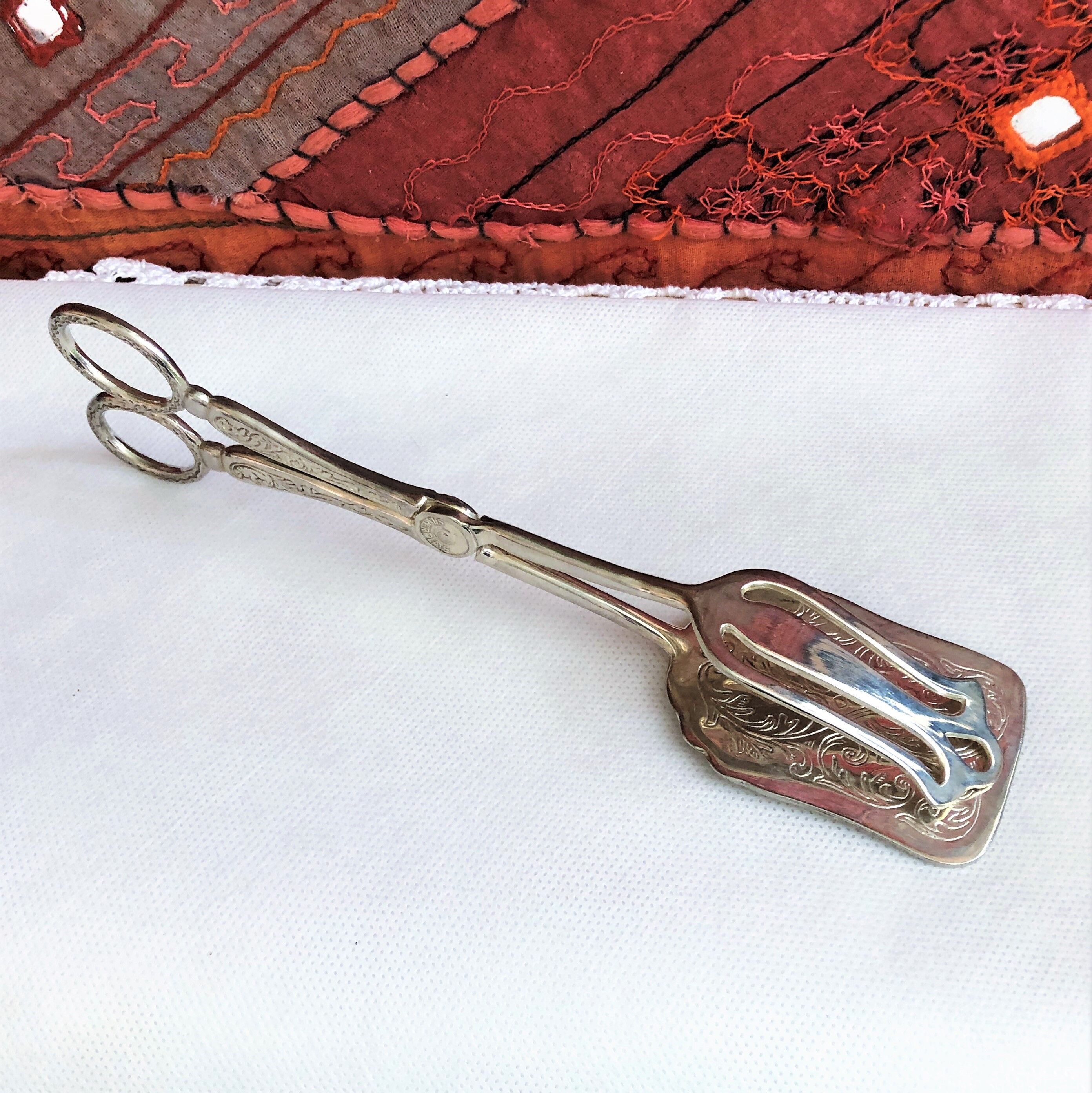 Wrought silver plated cake clips