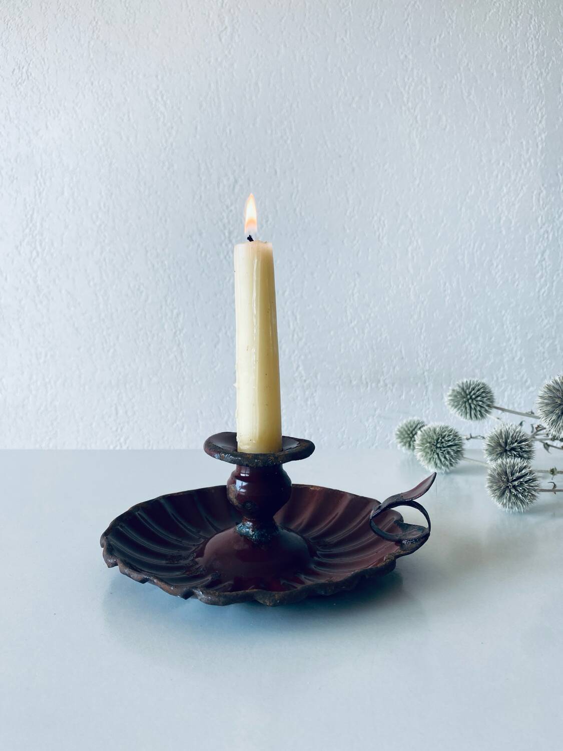 Antique enamelled candle holder