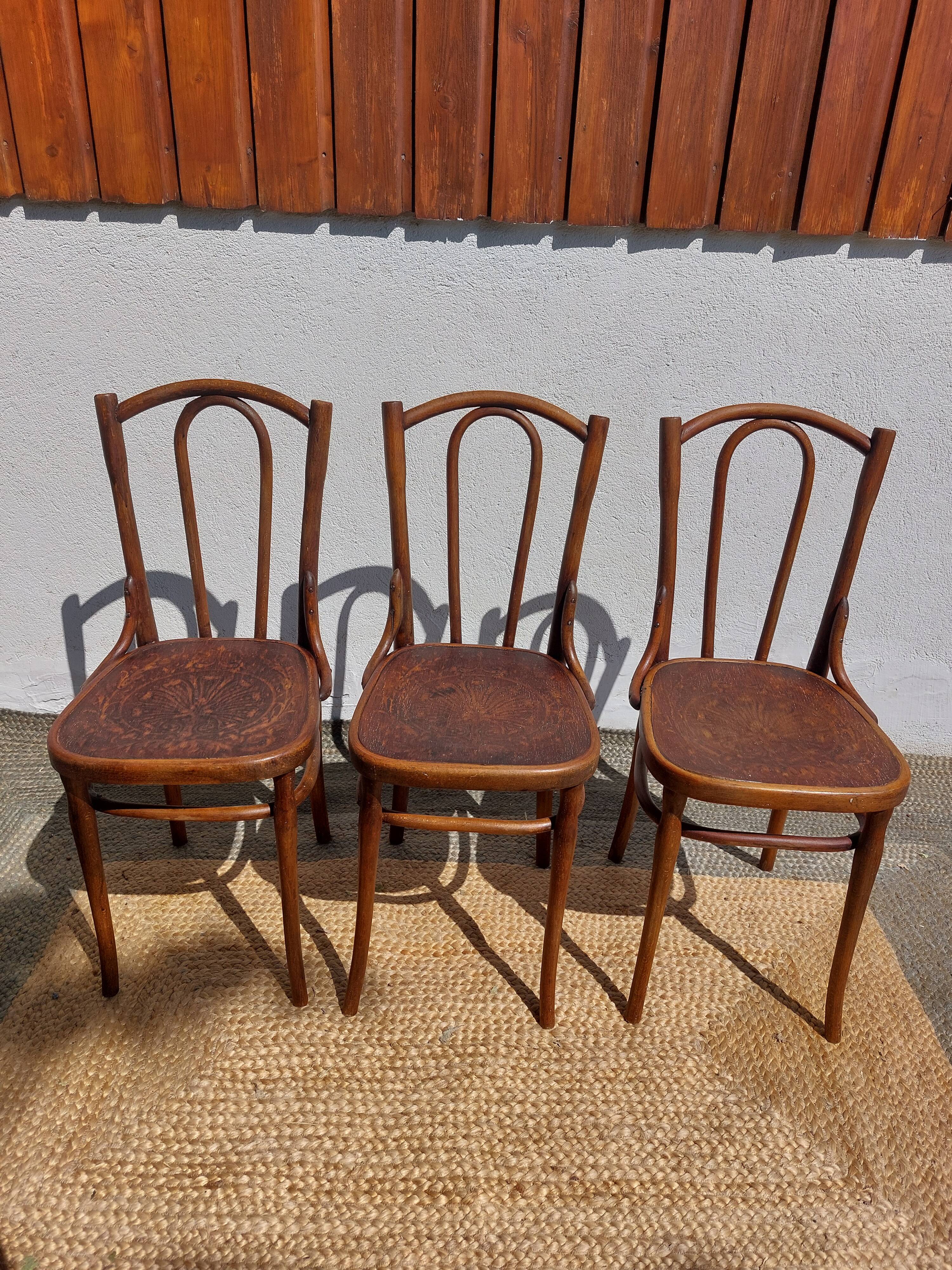 set of 3 curved wooden bistro chairs with patterns