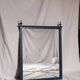 Restored vintage mirror in navy blue, Louis XVI style.