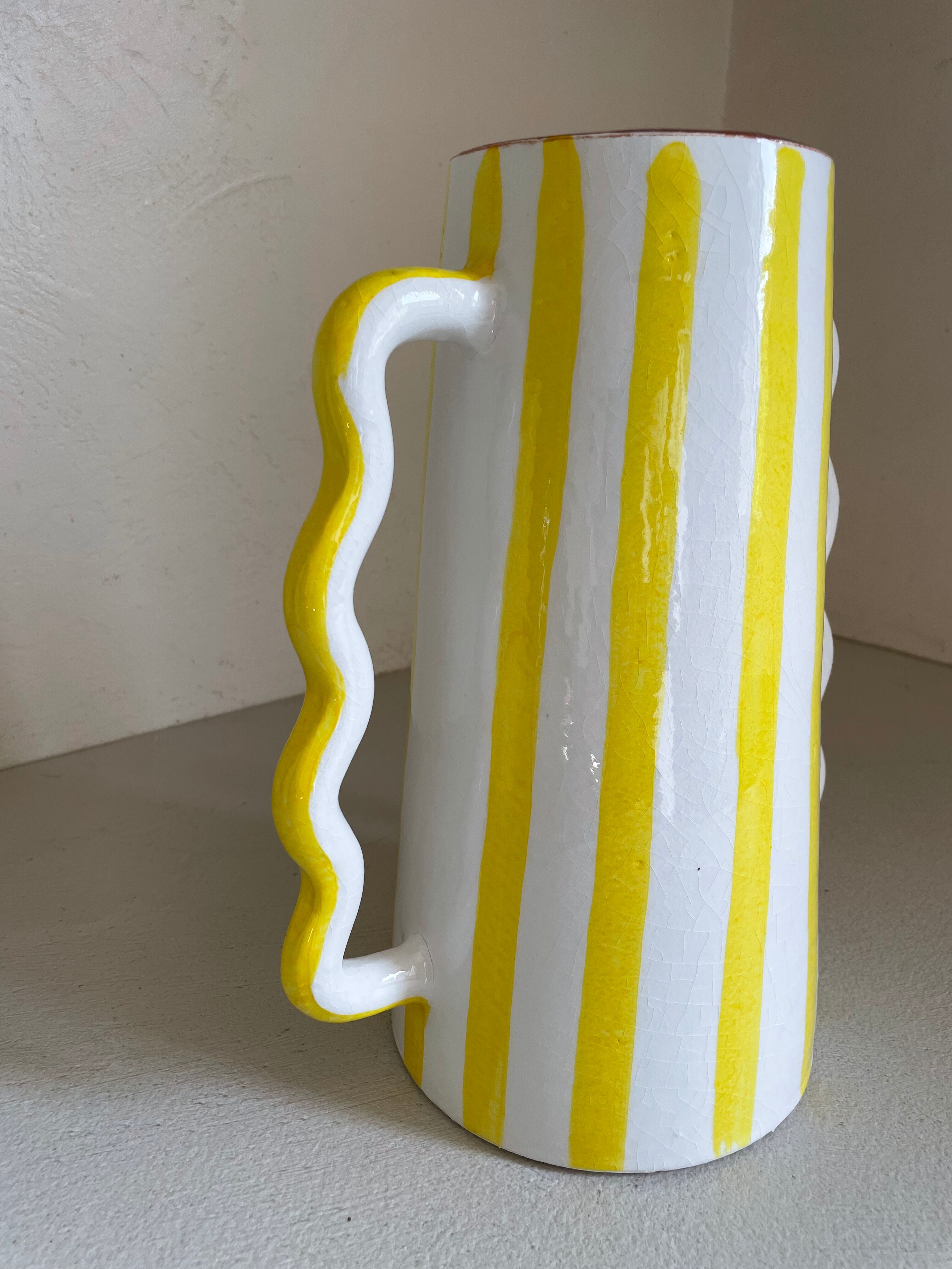 Lemon yellow and white striped ceramic vase with abstract wavy handmade handheld