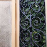 Porte d'entrée cintrée double en chêne, grilles et verre, XIXème