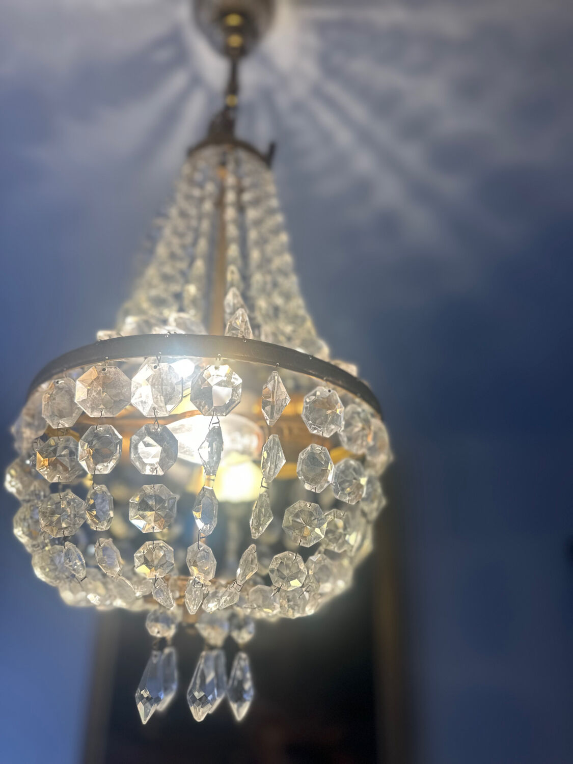 Basket chandelier with crystal and gilded brass pendants, circa 1930.