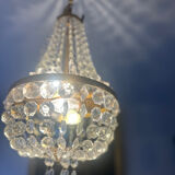 Basket chandelier with crystal and gilded brass pendants, circa 1930.