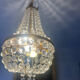 Basket chandelier with crystal and gilded brass pendants, circa 1930.