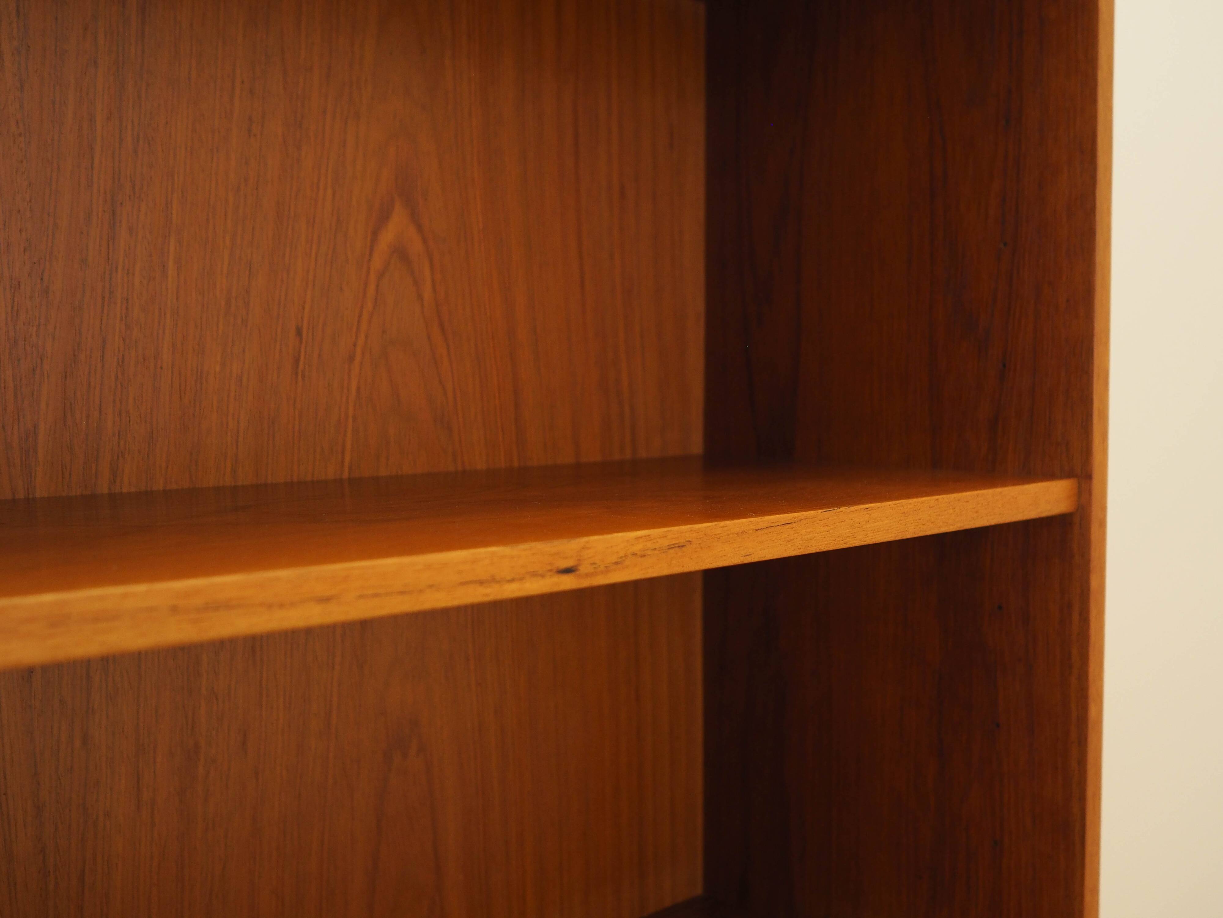 Danish teak-veneered bookcase with a bar and adjustable shelves, 1970s.