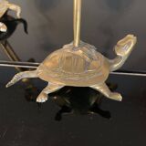 Pair of chiseled and gilded bronze candlesticks depicting perched waders