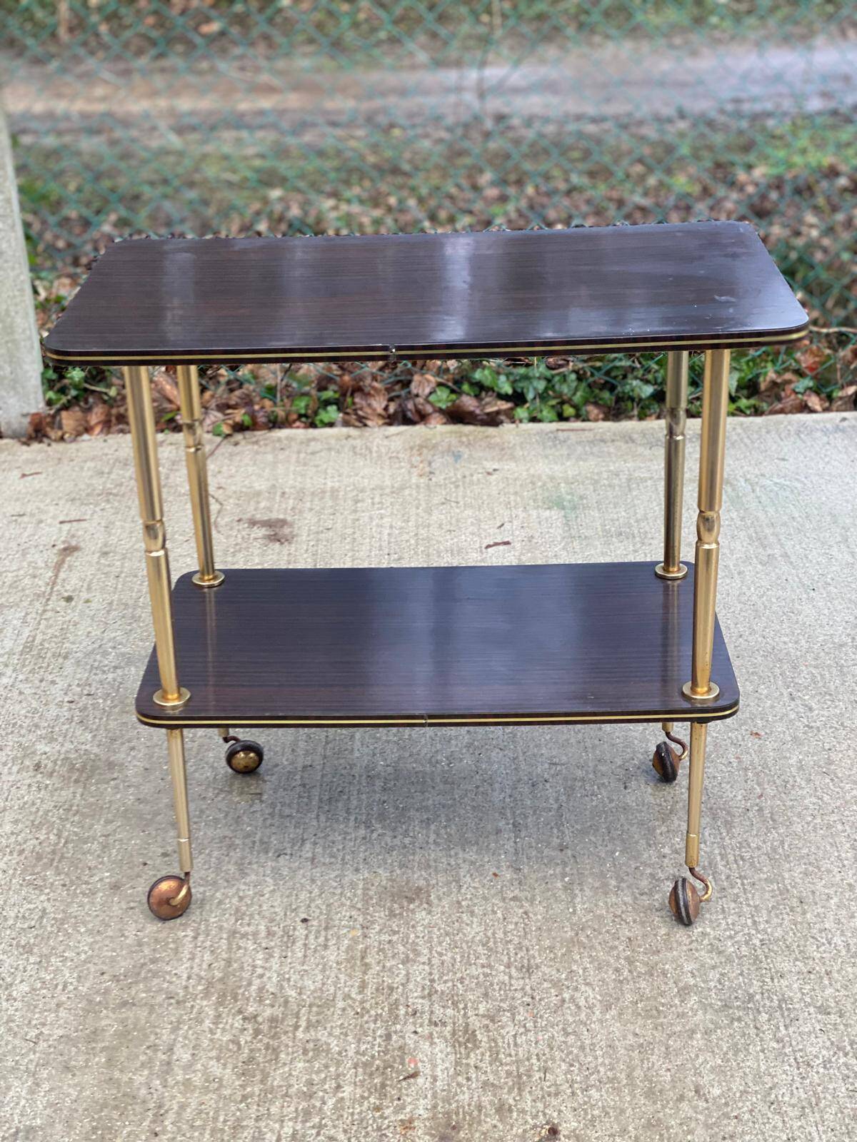 Brown rosewood rolling table with gold legs