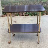 Brown rosewood rolling table with gold legs