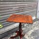 19th-century solid mahogany table with a tilting top and brass mechanism.