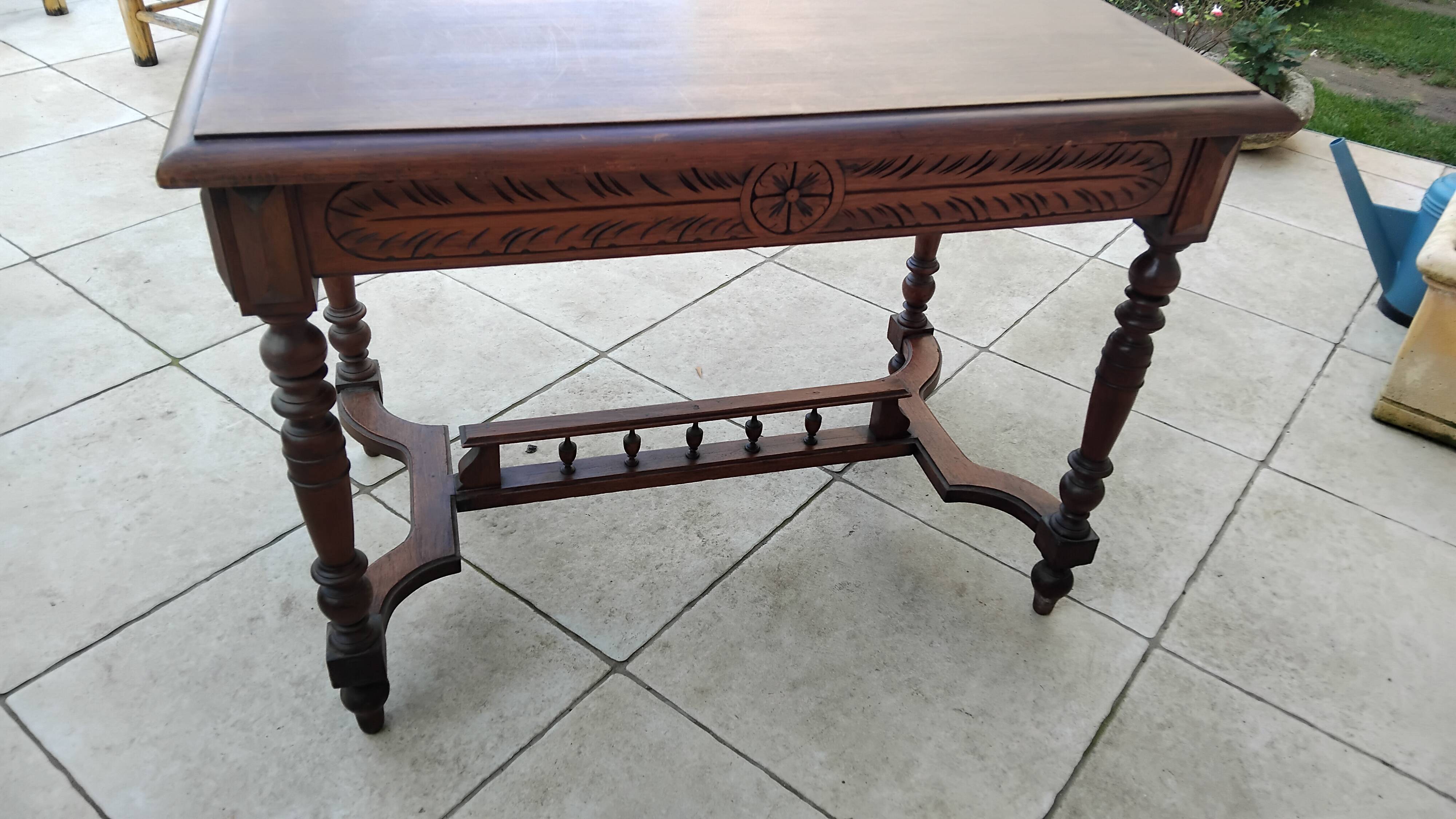 Antique desk or small table in solid carved wood