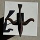 Traditional Indonesian decorative wooden bird on a base, crest model.