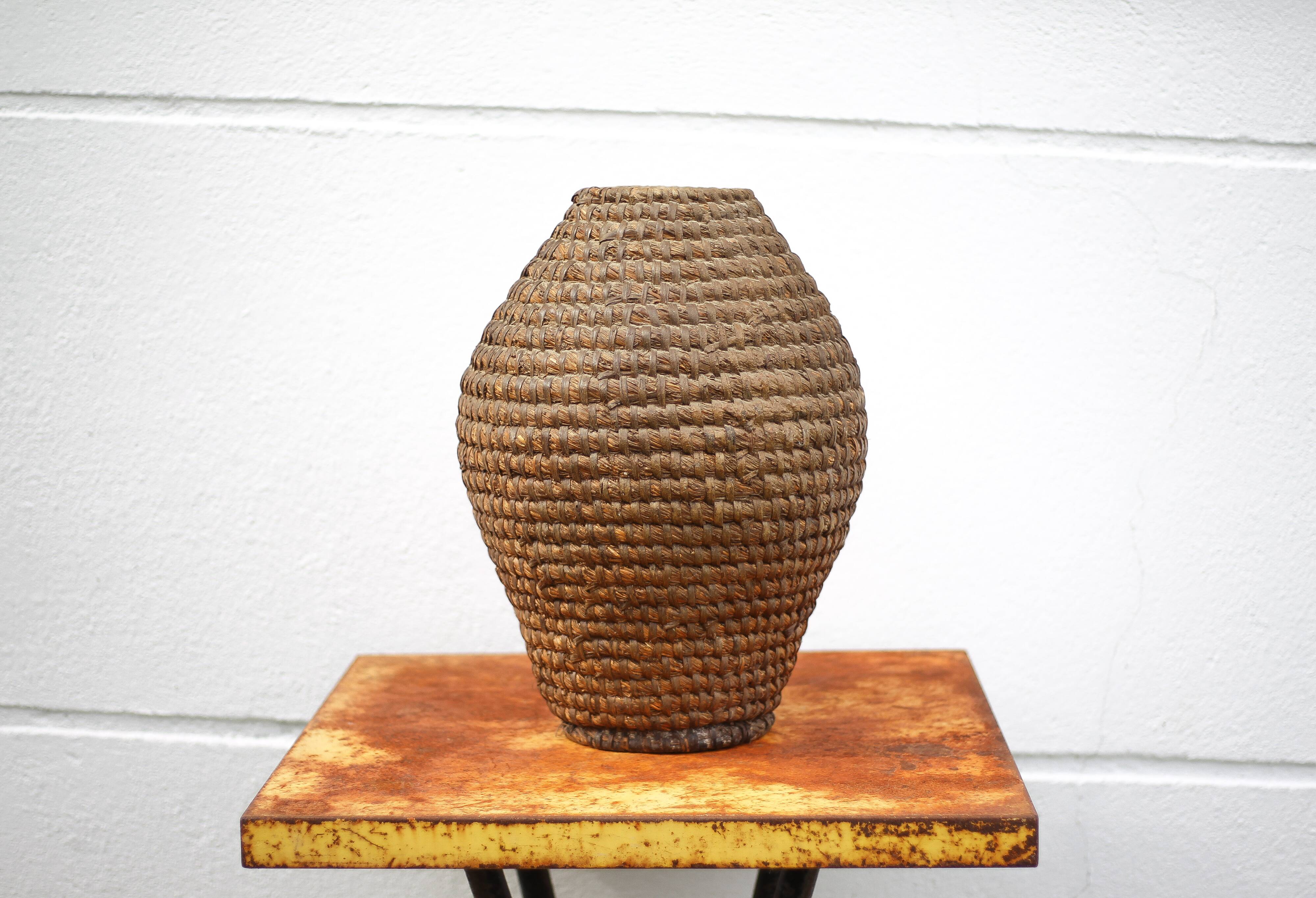 Old basket, burgundy straw and bramble, woven basket, interior decoration